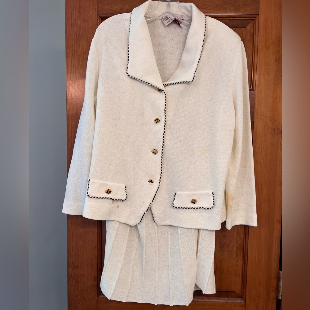 White knit skirt suit with black and gold buttons